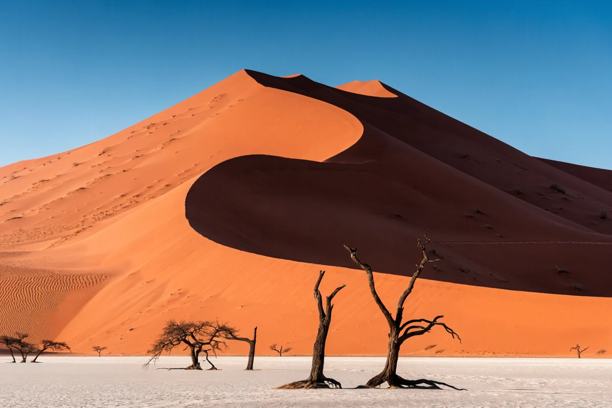 AI-generated illustration: Sossusvlei-inspired dunes