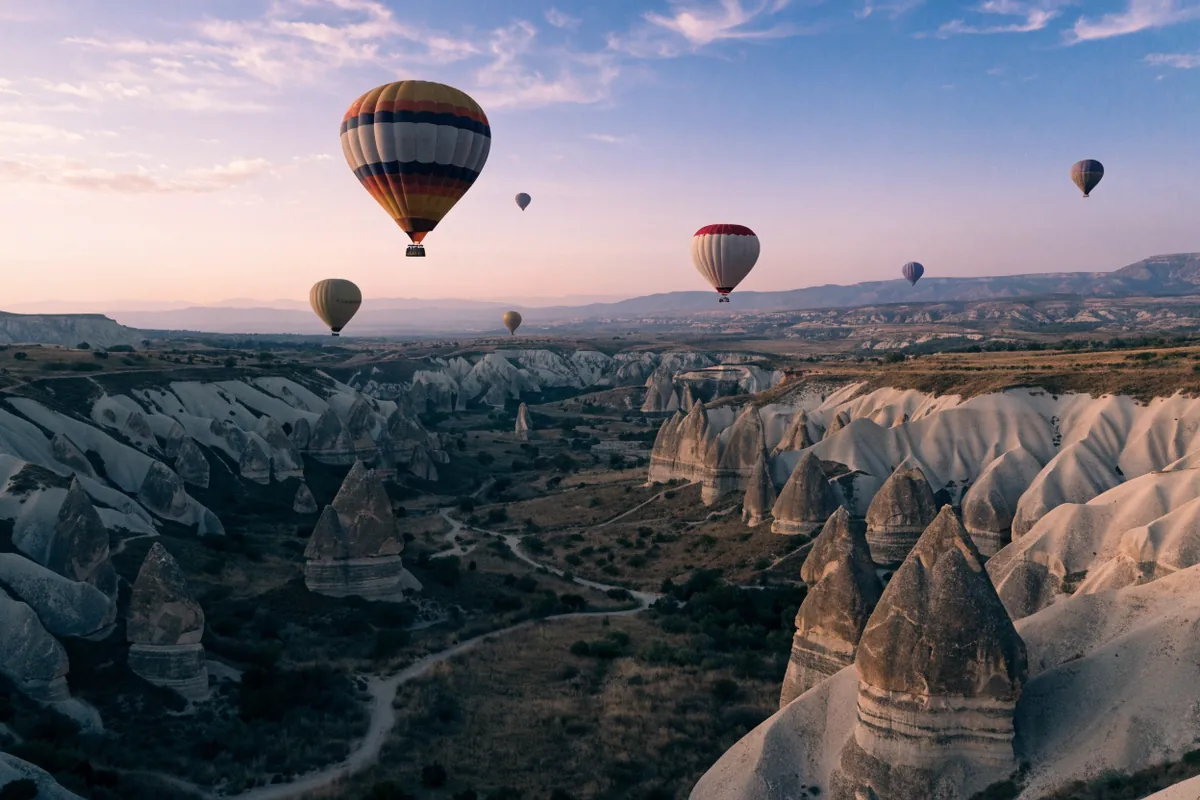 AI-generated illustration: Cappadocia-inspired valley